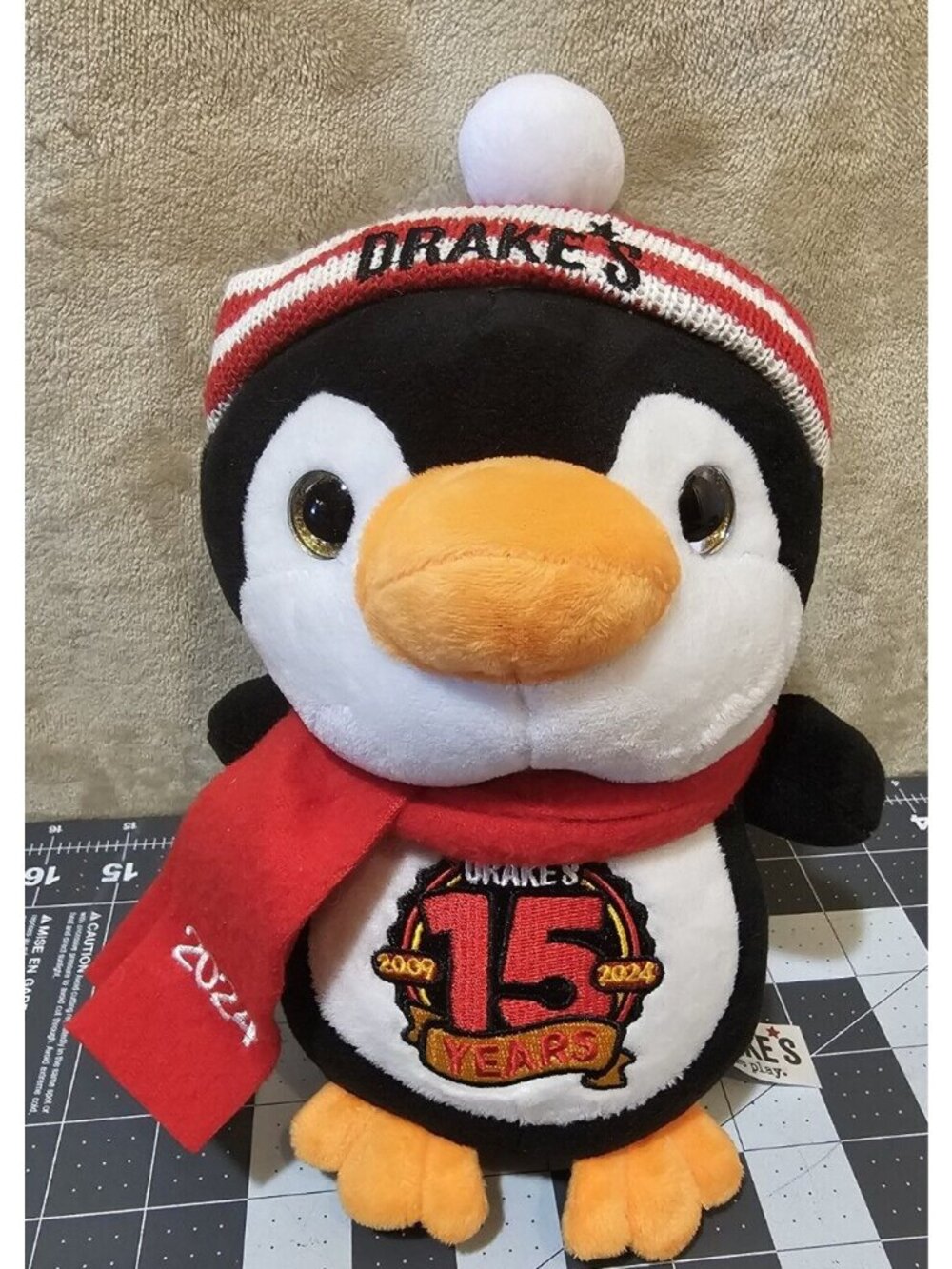 Drake’s Come Play Plush 2024 Rockhopper Penguin Drake’s Restaurant Bar Scarf